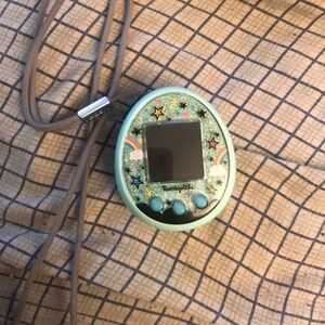 Rare green tamagotchi ON